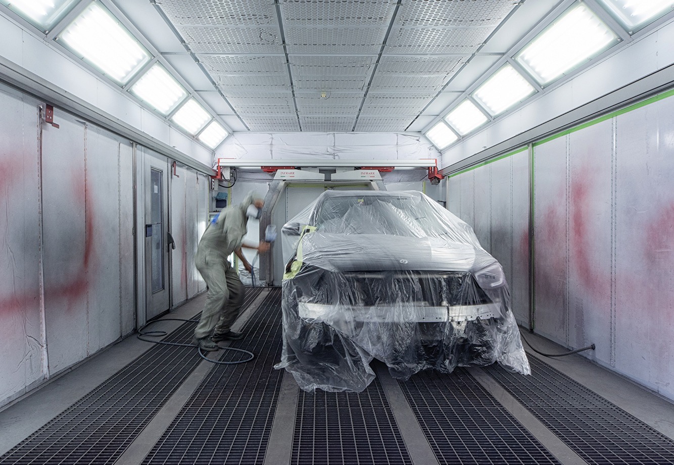 Professional automotive spray booth and refinishing workspace